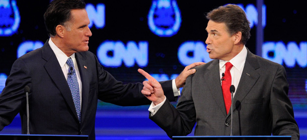 LAS VEGAS, NV &#8211; OCTOBER 18: Former Massachusetts Gov. Mitt Romney (L) and Texas Gov. Rick Perry participate in the Republican presidential debate airing on CNN, October 18, 2011 in Las Vegas, Nevada. Seven GOP contenders are taking part in the debate, which is sponsored by the Western Republican Leadership Conference in Las Vegas and held in The Venetian hotel&#8217;s Sands Expo and Convention Center. (Photo by Ethan Miller/Getty Images)
