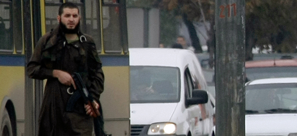 Mevlid Jasarevic (23), stands at an intersection holding an AK-47, after opening fire upon the United States Embassy in Sarajevo, on October 28, 2011. Police acted swiftly and after attempting an arrest, exchanged fire with Jasarevic. The attacker was wounded by Bosnian police, arrested and taken to hospital. His condition is unknown at the moment. AFP PHOTO ELVIS BARUKCIC (Photo credit should read ELVIS BARUKCIC/AFP/Getty Images)
