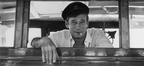 28th July 1965: French film star Yves Montand (Ivo Livi) (1921 &#8211; 1991) on board his yacht at Cannes during a holiday on the Cote d&#8217;Azur. (Photo by Keystone/Getty Images)
