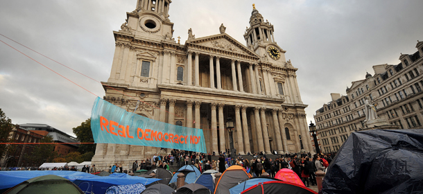 Protesters of the &#8216;Occupy London Stock Exchange&#8217; demonstration gather on the steps of St. Paul&#8217;s Cathedral behind their tents in London on November 2, 2011. London&#8217;s St. Paul&#8217;s Cathedral and the city authorities suspended legal action Tuesday against anti-capitalist protesters camped outside the historic landmark. AFP PHOTO / BEN STANSALL (Photo credit should read BEN STANSALL/AFP/Getty Images)
