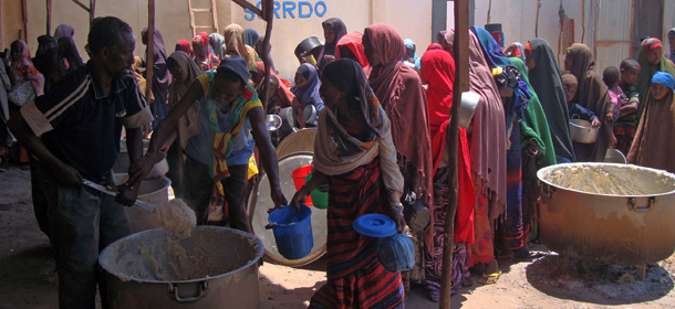 Internally displaced women queue for food rations at a feeding centre on October 17, 2011 as thousands flee severe droughts that have hit southern Somalia. Somalia is the worst hit of several East African countries affected by the regions&#8217; worst drought in decades. The UNHCR is assisting some 800,000 Somali refugees in neighbouring countries but it is unable to provide relief to an estimated 3.7 million people in need of urgent help inside Somalia.The capital Mogadishu is officially under the control of forces supporting the Western-backed transitional government but security has yet to be restored to a level that allows a large-scale humanitarian response. AFP PHOTO/Mohamed Abdiwahab (Photo credit should read Mohamed Abdiwahab/AFP/Getty Images)
