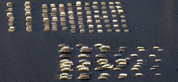 AYUTTHAYA,THAILAND &#8211; NOVEMBER 14: An aerial view of Honda vehicles at the flooded Honda factory in the Rojuna Industrial district on November 14, 2011 in Ayutthaya, Thailand. While the city of Ayutthaya is recovering from the floods the factories have remained underwater over the last month. Thailand has experienced it&#8217;s worst flooding in over 50 years and is now into it&#8217;s third month having affected over 25 of Thailand&#8217;s 64 provinces. Over 500 people have died in flood-related incidents since late July according to the Department of Disaster Prevention and Mitigation. (Photo by Paula Bronstein/Getty Images)
