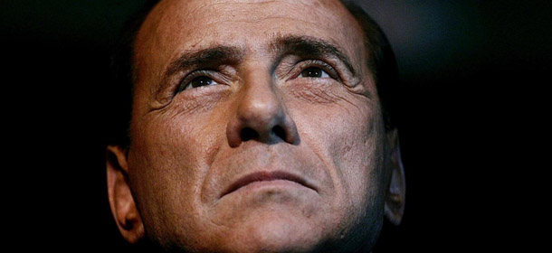 FILE &#8211; In this Friday, Feb. 3, 2006 file photo, Italian Premier Silvio Berlusconi attends an Italian Republican party program conference in Rome. Pressure mounted on Premier Silvio Berlusconi to resign so a new government could pass the economic reforms Italy needs to avoid financial disaster, as the country&#8217;s borrowing rates spiked Monday, Nov. 7, 2011, and talk of early elections intensified. (AP Photo/Gregorio Borgia, File)
