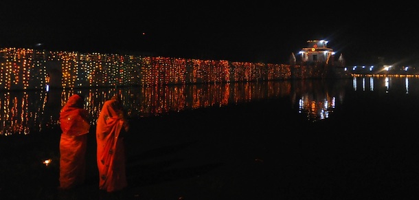 Nepalese Hindu devotees worship the rising sun as they stands in the Rani Pokhari during the Chhath festival, which honours the Sun God, in Kathmandu on November 2, 2011. People pay obeisance to both the rising and setting sun during the Chhath festival, people express their thanks and seek blessings from the forces of nature, mainly the sun and river. AFP PHOTO / Prakash MATHEMA (Photo credit should read PRAKASH MATHEMA/AFP/Getty Images)
