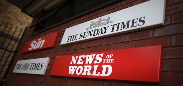 LONDON, ENGLAND &#8211; JULY 07: Signs for the four newspapers belonging to News International dominate a wall at the Wapping production plant on July 7, 2011 in London, England. James Murdoch has announced the closure of The News of The World Newspaper this Sunday. (Photo by Peter Macdiarmid/Getty Images)
