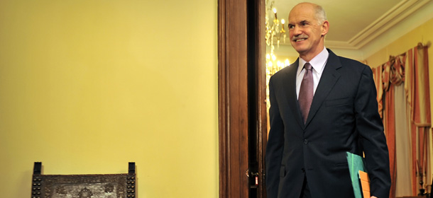 Greek Prime Minister George Papandreou arrives at the presidental palace in Athens on November 6, 2011 for meeting with Greek President Carolos Papoulias and opposition leader Antonis Samaras. Papandreou agreed to step down, removing a key stumbling block which had held up an accord just hours before nervous financial markets reopen on November 7 with the euro in the line of fire. AFP PHOTO / LOUISA GOULIAMAKI (Photo credit should read LOUISA GOULIAMAKI/AFP/Getty Images)

