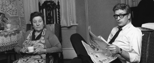 Actor Michael Caine (center) at home in England with his mother Ellen Micklewhite (d. 1989) and brother Stanley. (Photo by Harry Dempster/Getty Images)
