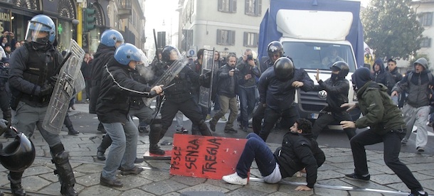 Students clash with police during a demonstration in Milan, Italy, Thursday, Nov. 17, 2011. University students are protesting in Milan and Rome against budget cuts and a lack of jobs, hours before new Italian Premier Mario Monti reveals his anti-crisis strategy in Parliament. Across Italy, transport unions called all-day walkouts or strikes of several hours Thursday to demand better work contracts. Scuffles among students were reported at the start of the demonstration in Milan, where they hoped to march to Bocconi University, which trains Italy&#8217;s business elite. Monti, an economist, is Bocconi&#8217;s president and is scheduled to speak in the afternoon ahead of a confidence vote on the government he formed on Wednesday. (AP Photo/Luca Bruno)

