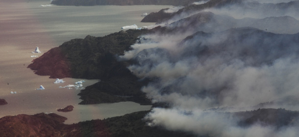 In this handout photo released by Gobernacion de Magallanes, smoke raises from several areas of Torres del Paine National Park in Torres del Paine, Chile, Friday, Dec. 30, 2011. Around 8,500 hectares have been affected by a wildfire at the park. (AP Photo/Gobernacion de Magallanes)
