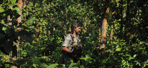 An Indian paramilitary force (CRPF) soldiers participates a search operation close to the spot where Maoist leader Kishenji was shot during an encounter with security personnel in a jungle area at Burisole some 200kms south-west of Kolkata on November 25, 2011. Police are searching for three Maoist rebels who escaped a fierce gunbattle in eastern India during which one of the guerillas&#8217; top leaders was killed. Maoist commander Koteswar Rao, better known as Kishenji, was shot dead after being chased down by security forces in Burisole forest of West Bengal state late November 24. AFP PHOTO/Dibyangshu SARKAR (Photo credit should read DIBYANGSHU SARKAR/AFP/Getty Images)
