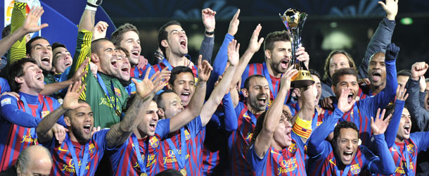 FC Barcelona players celebrate after their victory over Santos FC in the FIFA Club World Cup football final match in Yokohama on December 18, 2011. Lionel Messi grabbed a brace as a rampant Barcelona out-classed the Brazilians Santos 4-0 to lift the Club World Cup and confirm their status as the best team on the planet. AFP PHOTO / KAZUHIRO NOGI (Photo credit should read KAZUHIRO NOGI/AFP/Getty Images)
