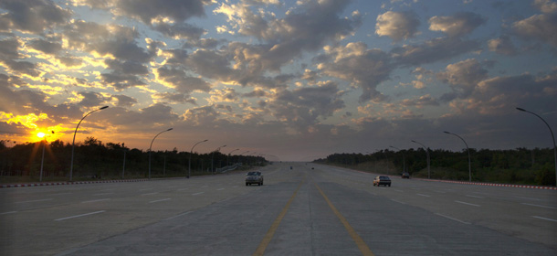 NAYPYITAW, MYANMAR &#8211; DECEMBER 5 : Wide roads with very little traffic leading to the Parliament complex December 5, 2011 in Nay Pyi Taw, Myanmar. NayPyiTaw is the capitol city of Myanmar, formally in Yangon until the Burmese government created a new secluded capitol closed off from much of the world until recently. The pace of change in Myanmar brought U.S Secretary of State Hillary Clinton to the country where she discussed further paths to reform and crucial talks with both Aung San Suu Kyi and the highest levels of the Burmese government. For many years Myanmar has suffered from economic stagnation, political repression and international isolation. In March the army handed power to a civilian government after almost five decades of the military regime&#8217;s strong arm rule. The handover took place after a controlled election under a new constitution that preserved much of the military clout. Internet has been loosened up as previously inaccessible foreign news and opposition websites have been unblocked. (Photo by Paula Bronstein/Getty Images)
