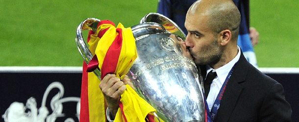 Barcelona&#8217;s Spanish coach Josep Guardiola kisses the trophy at the end of the UEFA Champions League final football match FC Barcelona vs. Manchester United, on May 28, 2011 at Wembley stadium in London.Barcelona won 3 to 1. AFP PHOTO / GLYN KIRK (Photo credit should read GLYN KIRK/AFP/Getty Images)
