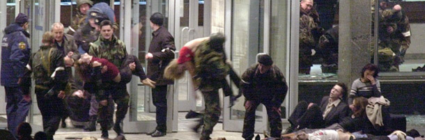 MOSCOW, RUSSIAN FEDERATION: (FILES) &#8212; A file photo taken 26 October 2002 in Moscow shows Special forces soldiers carrying out hostages during the storming of the theater building captured by Chechen gunmen leaving 117 hostages and 50 Chechen militants dead, almost all of them gassed by Russian forces in a controversial army assault. More than 100 people were reportedly killed and hundreds wounded 03 September 2004 as Russian special forces stormed a school to free scores of children and adults held hostage for almost three days by militants demanding independence for Chechnya. AFP PHOTO ITAR-TASS/JAPAN OUT (Photo credit should read ANTON DENISOV/AFP/Getty Images)
