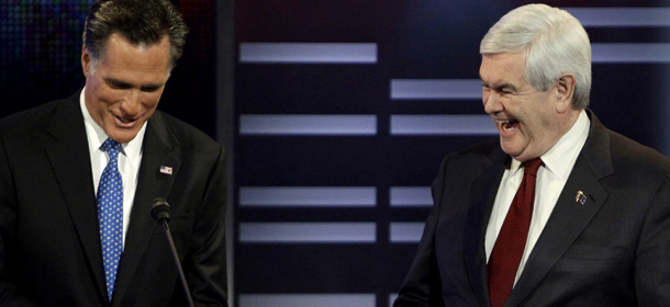 Republican presidential candidates former Massachusetts Gov. Mitt Romney, left, and former Speaker of the House Newt Gingrich, right, during the Republican debate, Saturday, Dec. 10, 2011, in Des Moines, Iowa. (AP Photo/Charlie Neibergall)
