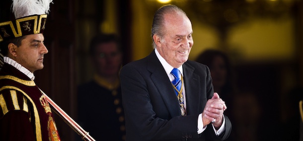 King Juan Carlos reacts during the official opening of Parliament, in Madrid, Tuesday, Dec. 27, 2011. (AP Photo/Daniel Ochoa de Olza)
