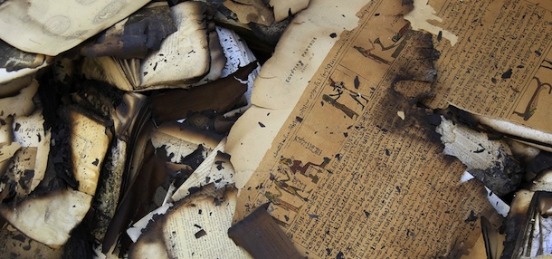 A picture shows burnt and damaged books at the Institute of Egypt in central Cairo on December 19, 2011 after the world-famous centre caught fire during deadly clashes between security forces and protesters. The heavily damaged historic centre for the advancement of scientific research, housing priceless national archives, was founded in 1798 during Napoleon Bonaparte&#8217;s expedition to Egypt, and contained more than 20,000 precious documents and manuscripts. AFP PHOTO/MOHAMMED ABED (Photo credit should read MOHAMMED ABED/AFP/Getty Images)
