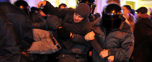 Russian policemen detain an opposition supporter during a rally in central St. Petersburg on December 5, 2011. Thousands of Russians rallied in central Moscow and Saint Petersburg protesting against violations in legislative elections that handed victory to Vladimir Putin&#8217;s ruling party with a reduced majority. AFP PHOTO / OLGA MALTSEVA (Photo credit should read VYACHESLAV OSELEDKO/AFP/Getty Images)
