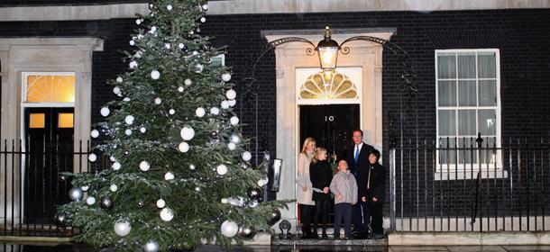 LONDON, ENGLAND &#8211; DECEMBER 01: British Prime Minister David Cameron, Blue Peter presenter Helen Skelton, and Blue Peter Badge winners turn on the Christmas tree lights at 10 on December 1, 2011 in London, England. The tree was grown by Andrew Ingram on Christmas Common near Thame in Oxfordshire. (Photo by Dan Kitwood/Getty Images)
