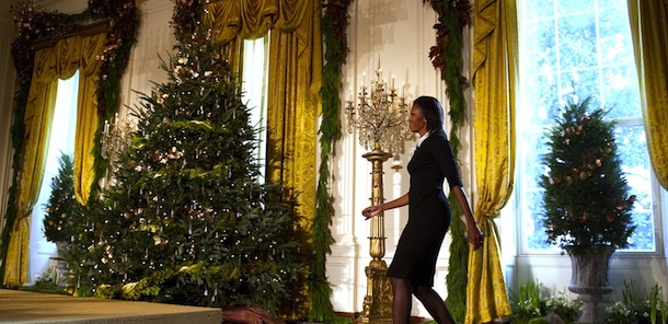 First Lady Michelle Obama arrives to make remarks during the press preview of the White House Christmas decorations in Washington, DC, November 30, 2011. The White House chose a theme of &#8220;Shine, Give, Share&#8221; celebrating the countless ways we can lift up those around us. AFP PHOTO/Jim WATSON (Photo credit should read JIM WATSON/AFP/Getty Images)

