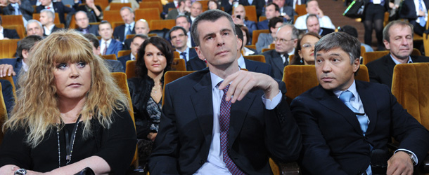 Russian billionaire, the leader of pro-reform Pravoye Delo (A Just Cause) party, Mikhail Prokhorov (C), and pop singer, Alla Pugacheva (L), take part at a congress of Prokhorov&#8217;s party in Moscow, on September 15, 2011. Prokhorov launched today an unprecedented attack on the Kremlin&#8217;s top ideologue, accusing him of stifling debate and misleading the country&#8217;s leadership. AFP PHOTO / NATALIA KOLESNIKOVA (Photo credit should read NATALIA KOLESNIKOVA/AFP/Getty Images)
