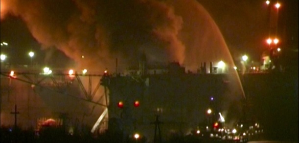 In this framegrab image from Ru-RTR Russian state channel, smoke rises from a dock where the Yekaterinburg nuclear submarine is for repairs at the Roslyakovo shipyard in the Murmansk region, Russia, Thursday, Dec. 29, 2011. A massive fire engulfed a Russian nuclear submarine at an Arctic shipyard Thursday, but there has been no radiation leak, or injuries, officials said. The fire at the Yekaterinburg nuclear submarine occurred while it was in dock for repairs at the Roslyakovo shipyard. The Yekaterinburg is a Delta-IV-class nuclear-powered submarine that normally carries 16 nuclear-tipped intercontinental ballistic missiles. Defense Ministry spokesman Igor Konashenkov told The Associated Press that all weapons had been unloaded from the sub and its reactor had been shutdown to safety before the repairs. (AP Photo/Ru-RTR Russian state channel) TV OUT
