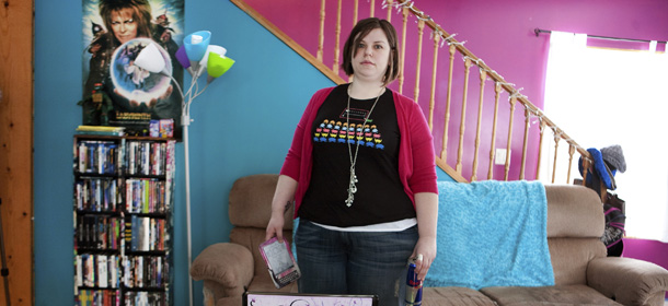 In this March 11, 2011 photo, author Amanda Hocking, left, 26, sits in her home in Austin, Minn. Trying to make it as a writer, Hocking stumbled across a promising new business model for aspiring authors: self-publishing and marketing through e-booksellers. (AP Photo/Robb Long)