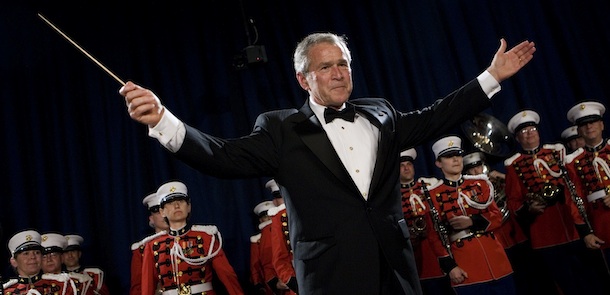 President Bush turns to the audience after conducting the United States Marine Corps Band, known as "The President's Own," during the annual dinner of the White House Correspondents' Association, Saturday, April 26, 2008, in Washington. (AP Photo/Haraz N. Ghanbari)