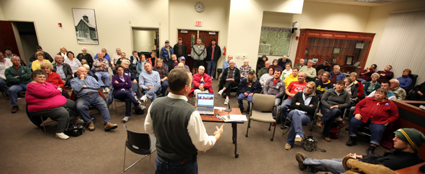 Dan West, Precinct Caucus Chairman, speaks to attendees of the 2012 Republican Caucus Tuesday Jan. 3, 2012 at West Burlington City Hall in West Burlington, Iowa. (AP Photo/The Hawk Eye, Brenna Norman)