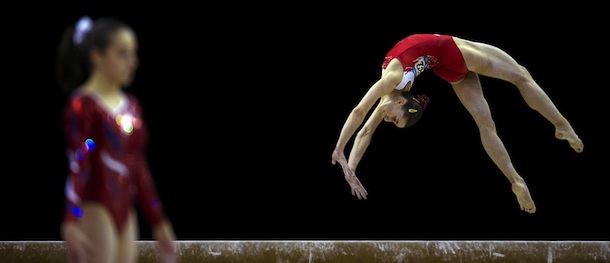 Beatriz Cuesta (R) of Spain performs on the beam during the women's qualification of the Artistic International Gymnastics London 2012 Olympic qualifier, a part of the London Prepares series of test events, at the North Greenwich Arena in London on January 11, 2012. AFP PHOTO / ADRIAN DENNIS (Photo credit should read ADRIAN DENNIS/AFP/Getty Images)