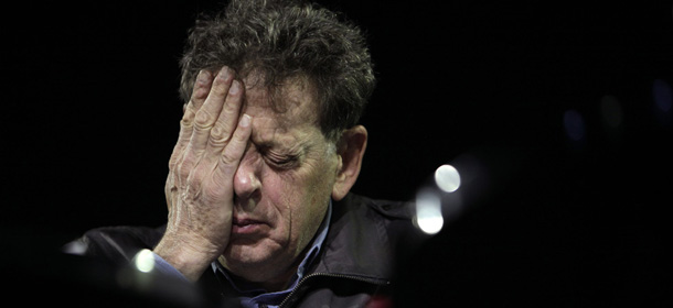 U.S. composer Philip Glass touches his face during a news conference in Mexico City, Thursday, Nov. 5, 2009. Glass is scheduled to play two concerts in the city this week. (AP Photo/Gregory Bull)