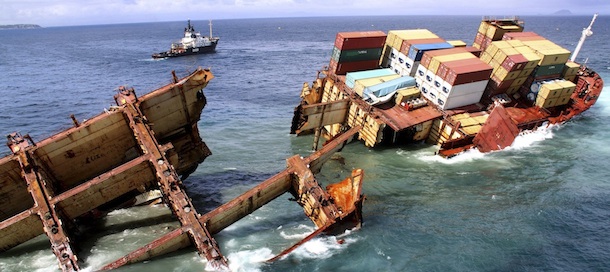 In this photo provided by Maritime New Zealand half of the cargo ship Rena is sinking on a reef near Tauranga, New Zealand, Tuesday, Jan. 10, 2012. The 774-foot (236-meter) vessel split in two over the weekend amid heavy seas and now the stern section is slipping from the Astrolabe reef and sinking. (AP Photo/Maritime New Zealand, Graeme Brown) Editorial Use Only