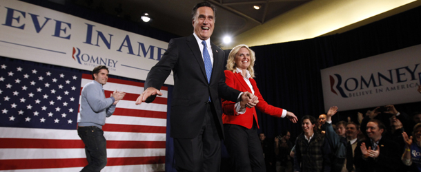 Republican presidential candidate former Massachusetts Gov. Mitt Romney, walks with his wife Ann at his caucus night rally in Des Moines, Iowa, Tuesday, Jan. 3, 2012. (AP Photo/Charles Dharapak)