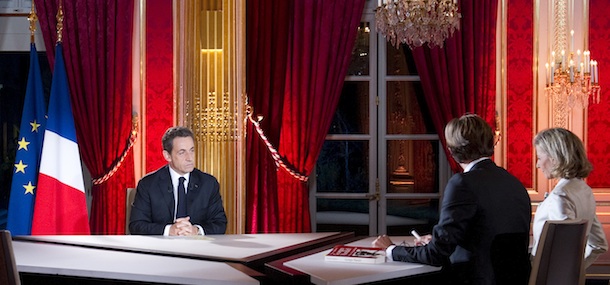 French President Nicolas Sarkozy, left is seen shortly before an interview on French television at the Elysee Palace in Paris, Sunday Jan. 29, 2012. President Nicolas Sarkozy is blanketing France's top TV news shows in a prime-time interview as polls show him trailing the Socialist nominee before this spring's presidential election.(AP Photo/Lionel Bonaventure/Pool)