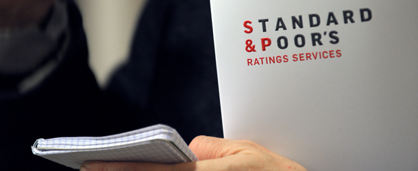 A picture shows Ratings agency Standard &amp; Poor's logo on a document in their Paris office prior a yearly press conference about "macro economic outlook and general trends on credit markets, focus on credit condition in France and in Europe by sector" in Standard &amp; Poor's offices in Paris on December 8, 2011. AFP PHOTO ERIC PIERMONT (Photo credit should read ERIC PIERMONT/AFP/Getty Images)