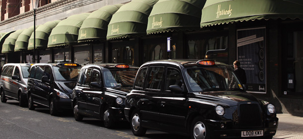 LONDON, ENGLAND - MARCH 24: Taxis queue outside Harrods department store in Knightsbridge on March 24, 2011 in London, England. Harrods has over one million square feet of retail space, spread over 330 departments. The world famous store was sold to Qatar Holdings in May 2010 for 1.5 billion GBP. Millions of tourists are expected to visit London for the wedding of Prince William and Kate Middleton in April 2011 and the Olympic Games in 2012. (Photo by Oli Scarff/Getty Images)