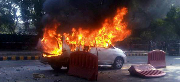 A car belonging to the Israeli Embassy goes up in flames after an explosion, in New Delhi, India, Monday, Feb. 13, 2012. The wife of an Israeli diplomat was injured in the explosion , the same day as an Israeli Embassy staffer in Georgia found a bomb underneath his car, which was dismantled before exploding, according to Indian and Israeli media reports.(AP Photo/Joji Thomas, Economic Times) INDIA OUT- FULL CREDIT MANDATORY