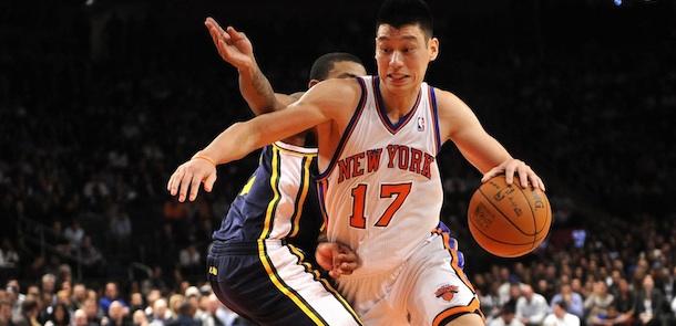 New York Knicks' point guard Jeremy Lin (17) drives the ball against Utah Jazz's point guard Earl Watson (11) during an NBA basketball game on Monday, Feb. 6, 2012, in New York. (AP Photo/Kathy Kmonicek)