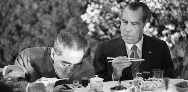 Using chopsticks with obvious success, U.S. President Richard Nixon eats at a Shanghai banquet, Sunday, Feb. 28, 1972. With him is China?s Premier Chou En-lai. (AP Photo)