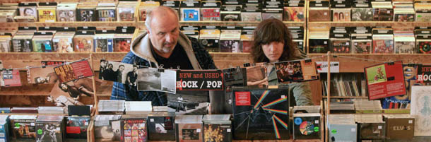 Mimi Zycherman, right, and Joe Zycherman browse merchandise at Easy Street Records on Friday, Nov. 25, 2011, in the West Seattle neighborhood of Seattle. About 30 or 40 Black Friday shoppers waited in line to purchase limited-edition vinyl records and CDs exclusive to independent music stores. (AP Photo/The Seattle Times, Erika Schultz) MAGS OUT; NO SALES; SEATTLEPI.COM OUT; MANDATORY CREDIT; USA TODAY OUT; MANDATORY CREDIT; TV OUT