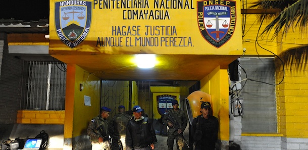 Army and police personnel stand guard at the National Prison of Comayagua where at least 200 prisioners were killed and scores injured when fire tore through the prison in central Honduras, the Central American country's prisons director said. The prison held around 850 prisoners. AFP PHOTO Orlando SIERRA (Photo credit should read ORLANDO SIERRA/AFP/Getty Images)