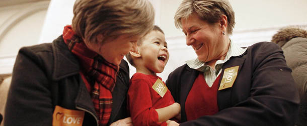 Amy Lewis, left, and Tricia Benson celebrate with their son, Will Lewis-Benson, 3, in the Maryland State House after the House of Delegates passed a gay marriage bill in Annapolis, Md., Friday, Feb. 17, 2012. (AP Photo/Patrick Semansky)