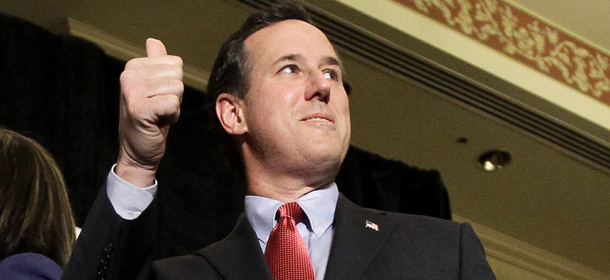 Republican presidential candidate former Pennsylvania Sen. Rick Santorum gives a thumbs up before speaking during a primary night watch party Tuesday, Feb. 7, 2012, in St. Charles, Mo. (AP Photo/Jeff Roberson)