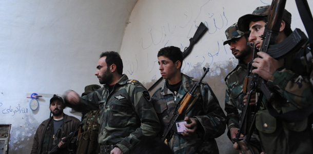 Armed Free Syrian Army rebels gather in the north Syrian city of Idlib on February 16, 2012. Syrian armour moved on the main hubs of an 11-month uprising with at least 22 killed in clashes, monitors said, a day after President Bashar al-Assad set a vote for a new constitution. AFP PHOTO/STR (Photo credit should read -/AFP/Getty Images)