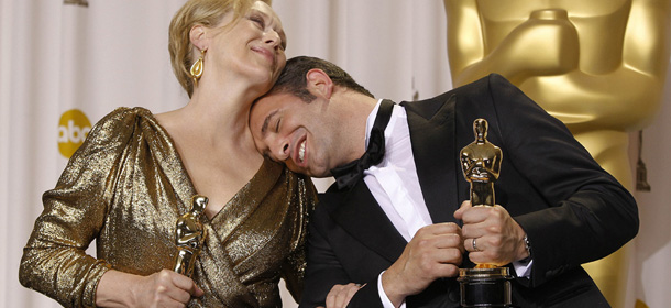 Best actress Meryl Streep, left, for "The Iron Lady" and best actor Jean Dujardin for "The Artist" pose with their awards during the 84th Academy Awards on Sunday, Feb. 26, 2012, in the Hollywood section of Los Angeles. (AP Photo/Joel Ryan)