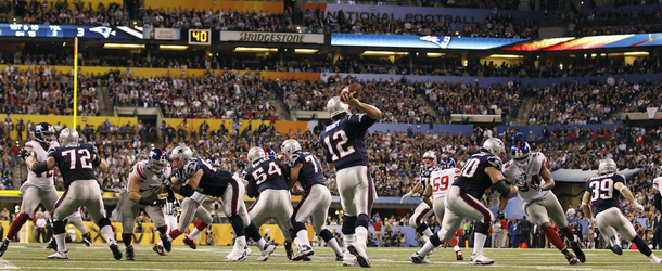 New England Patriots quarterback Tom Brady passes against the New York Giants during the first half of the NFL Super Bowl XLVI football game Sunday, Feb. 5, 2012, in Indianapolis. (AP Photo/Paul Sancya)
