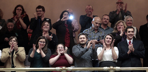 Spectators in the House gallery applaud after after legislators voted to legalize gay marriage in Washington state Wednesday, Feb. 8, 2012, in Olympia, Wash. The action comes a day after a federal appeals court declared California's ban on same-sex marriage unconstitutional, saying it was a violation of the civil rights of gay and lesbian couples. Gregoire is likely to sign the bill next week. (AP Photo/Elaine Thompson)