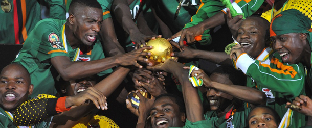 Zambia national football team players celebrate their victory with their trophy at the end of the African Cup of Nations final football match between Zambia and Ivory Coast on February 12, 2012, at the Stade de l'Amitie in Libreville. AFP PHOTO / ISSOUF SANOGO (Photo credit should read ISSOUF SANOGO/AFP/Getty Images)