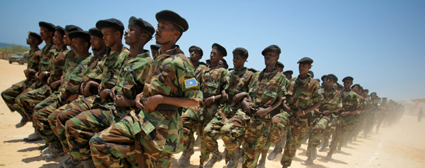 This handout picture released on March 17, 2012 by the African Union-United Nations Information Support Team shows Somali National Army (SNA) soldiers parading as part of a passing-out ceremony marking the conclusion of a 10-week advanced training course conducted by the military component of the African Union Mission in Somalia (AMISOM)Six-hundred thirty troops from different brigades of the SNA were taught and mentored on leadership skills, weapons handling field military tactics during the two and a half month course and will now deploy back to their units. AFP PHOTO/ AU-UN/ STUART PRICE

RESTRICTED TO EDITORIAL USE-MANDATORY CREDIT "AFP PHOTO/ AU-UN/ STUART PRICE"-NO MARKETING NO ADVERTISING CAMPAIGNS-DISTRIBUTED AS A SERVICE TO CLIENT (Photo credit should read STUART PRICE/AFP/Getty Images)