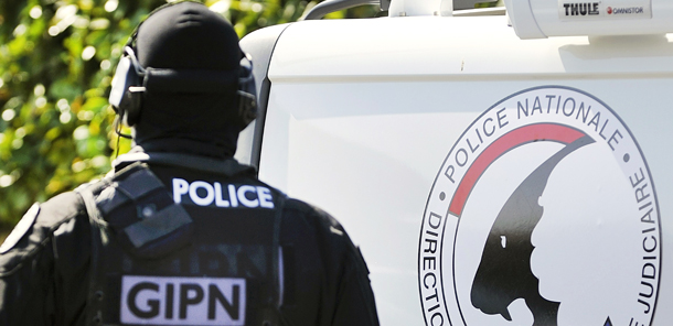 French members of the French National Police Intervention Group (GIPN) search a house in Bouguenais, western France, on March 30, 2012 as part of down raids in several French cities. French police arrested 19 people in a crackdown on suspected Islamist networks as President Nicolas Sarkozy made the battle against extremism the keynote of his re-election campaign. AFP PHOTO JEAN-SEBASTIEN EVRARD (Photo credit should read JEAN-SEBASTIEN EVRARD/AFP/Getty Images)